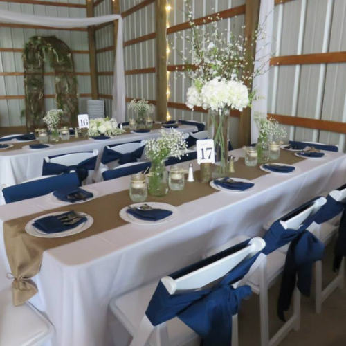 Table and chairs set up at an event