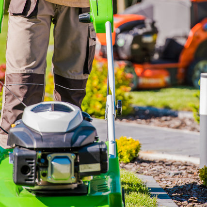 Landscaping RentalsLandscaper with a push mower