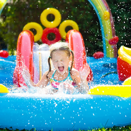 Party & Event RentalsGirl going down a water slide